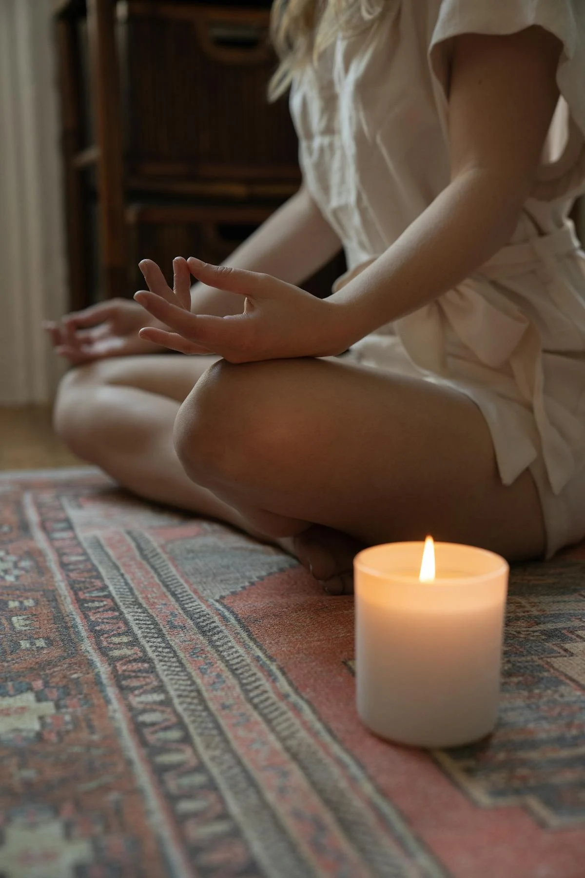 Peaceful meditation with candle - Zsofika Wellness Sanctuary